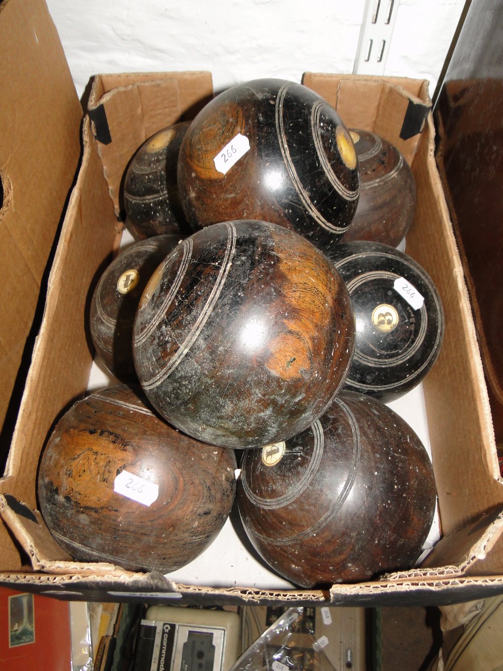 8 Lignum Vitae lawn bowls.