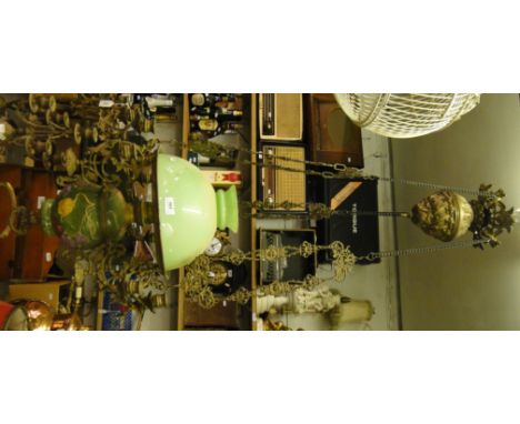 A brass framed hanging lantern with ceramic bowl and glass shade.