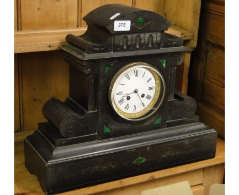 A 2-train mantel clock with inlaid slate case.
