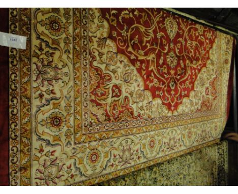 A red ground Keshan carpet 2.8 x 2m.