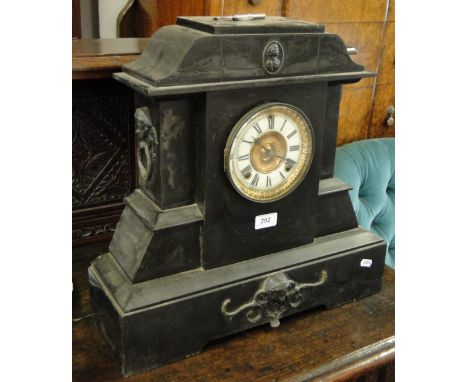 A large slate cased 2-train mantel clock.