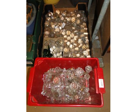 A large collection of glass decanter stoppers.