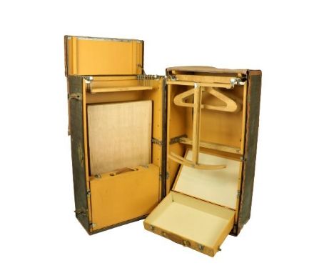 A large folding Louis Vuitton style Trunk Wardrobe, the entire covered in typical brown tartan design, with light brown leath