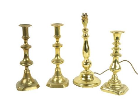 A brass Table Lamp and shade, a pair of 19th Century brass Candlesticks, 12'' (31cms) and a smaller ditto. (4) 