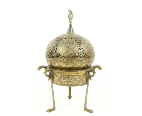 A late 19th Century Islamic brass, copper and silver Incense Burner, with pierced dome cover with Islamic tracery and inscrip