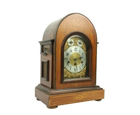 An Edwardian marquetry inlaid chiming dome top Bracket Clock, the brass and silverised dial with Arabic numerals, on rectangu