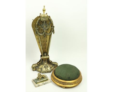 A pierced brass 'peacock' Firescreen, and a small 19th Century circular gilt Footstool, on brass ball feet, 30cms (12''), and
