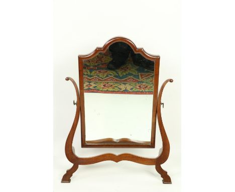 A George III style mahogany arch top swing frame Mirror, of shaped fret cut lyre frame, 19'' (49cms). (1)