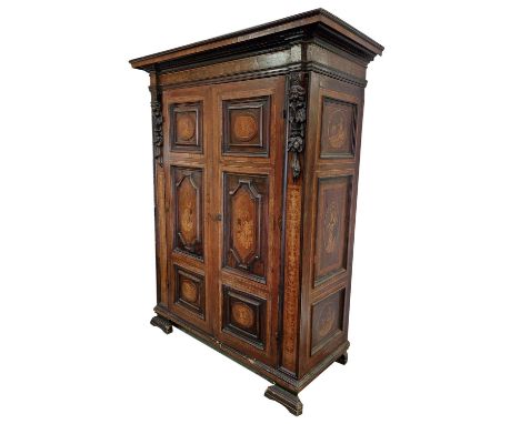 A very good 18th Century South German walnut and marquetry two door Cupboard or Wardrobe, with partially ebonised dentil moul