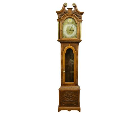 A 19th Century oak framed Grandfather Clock, the swan neck pediment with circular ormolu mounts over an arched brass and silv