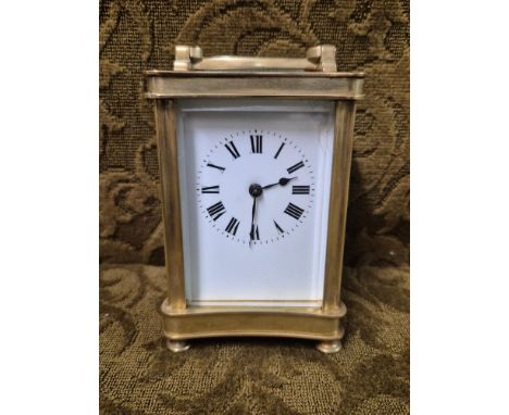 Mid 20th century brass carriage clock with working French movement and bevel glass apertures. 