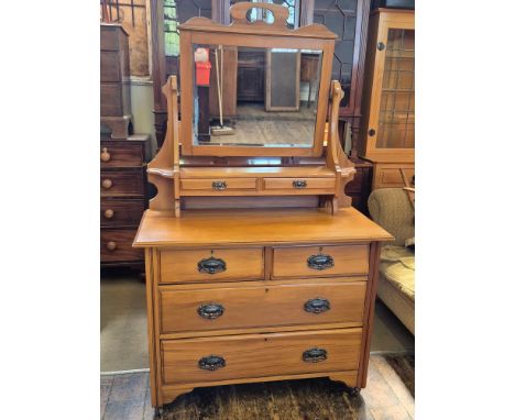 Victorian satin walnut dressing chest with coppered plate handles and bevel edged vanity mirror.  106cm wide x 49cm deep x 17