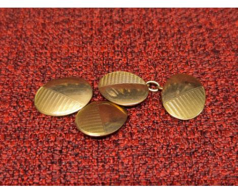 Pair of 9ct gold gents cufflinks with engine turned decoration, 6g.
