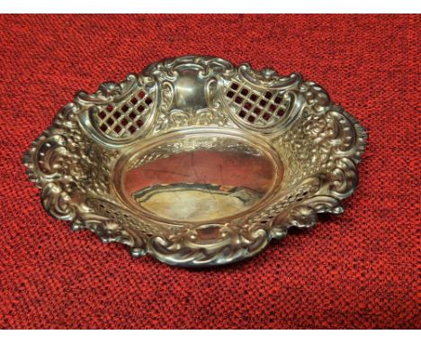 Silver pierced dish with embossed flowers and sea scrolls by C.J. Vander Ltd., London 1972, 77g.  155mm diameter together wit