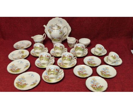 Regency china fox hunting scene teaset comprising teapot, 6 large teacups and saucers, 4 tea plates, cake plate, milk jug, cr