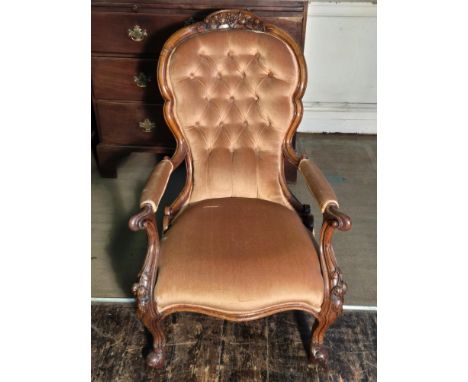 Victorian mahogany spoon back chair with fruit carved top rail and scrolled arms, button upholstery.