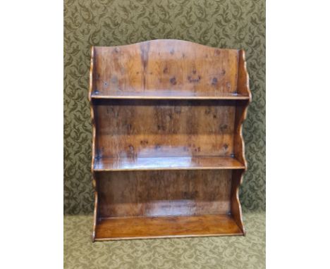High quality polished yew wood wall hanging shelf set with shaped support ends.