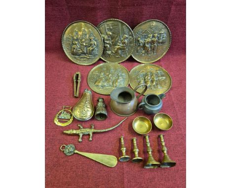 Small collection of brass and metalwares to include platters, powder flask, nutcrackers, etc.