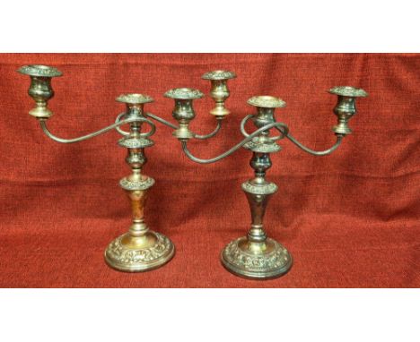 Pair of silver plated candlestick candelabra with acanthus leaf decoration.