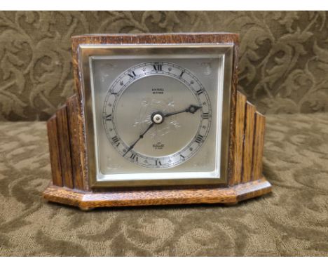1930's oak cased Elliott mantle clock with engraved dial and Roman numeral chapter ring.