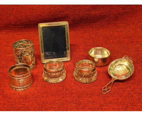 Small items of sterling silver to include photograph frame, Walker & Hall strainer and cup, napkin ring and souvenir Ypres na