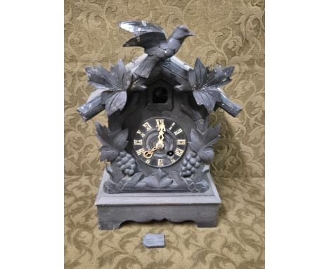 Early 20th century Black Forest carved cuckoo clock, needs attention.