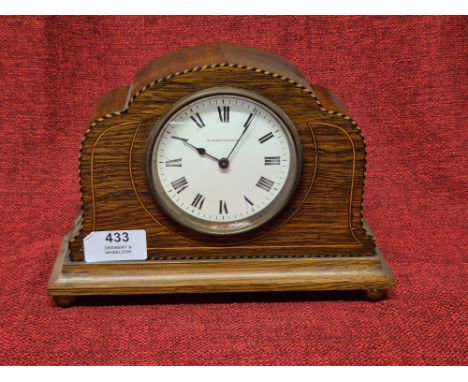 Edwardian oak cased mantle clock by Elkington & Co. Ltd with inlaid stringings upon brass ball feet.