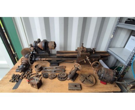 Vintage Britannia Colchester lathe complete with accessories, cast iron stands and untested motor.