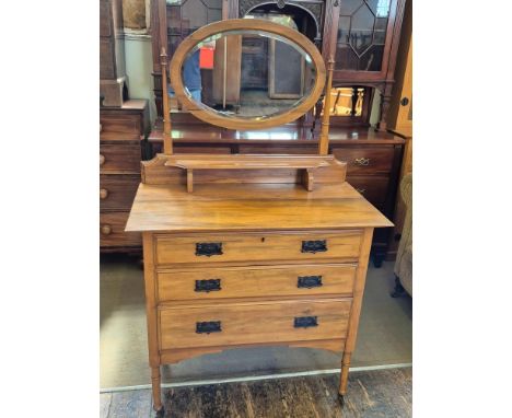 Late Victorian satin walnut dressing chest with coppered plate handles and bevel edged vanity mirror.