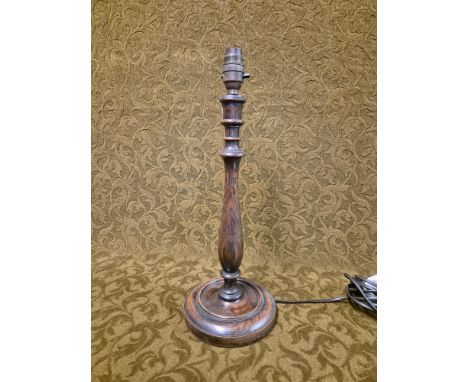 Turned oak table lamp standing 42cm tall.