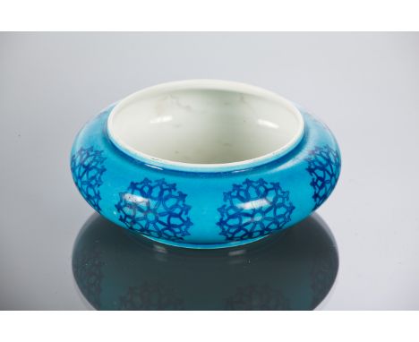 CHINESE CERAMIC DISH
of circular form and with blue stylised motifs on a pale blue ground, 11cm diameter 