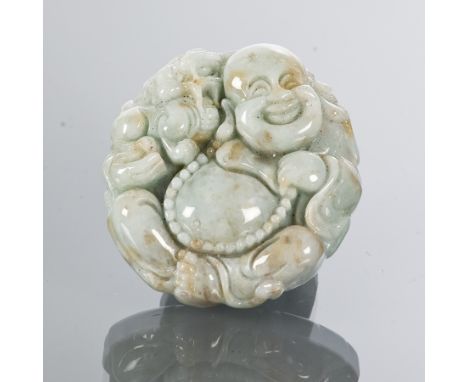 CHINESE JADE AMULET
of circular form and depicting a Buddha, 4.5cm wide