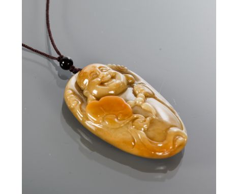 CHINESE JADE AMULET
depicting a Buddha, on fabric chain, 5.5cm high 