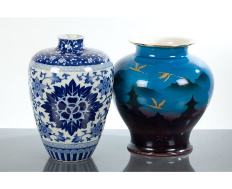 CHINESE BLUE AND WHITE VASE AND A JAPANESE VASE
the Chinese vase of baluster form, 28cm high; the Japanese vase with subtle a