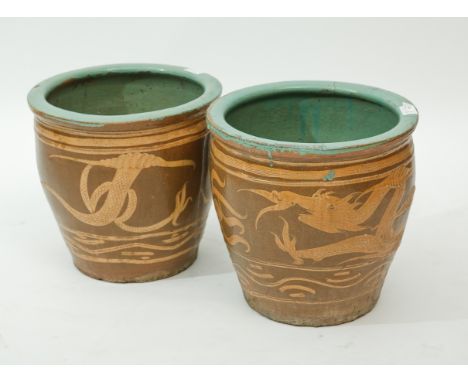 PAIR OF LARGE CHINESE STONEWARE PLANTER 
with dragon chasing the flaming pearl, both 43.5cm in diameter 