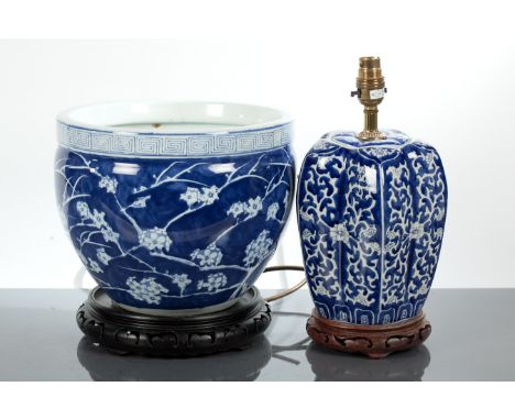 20TH CENTURY CHINESE BLUE AND WHITE PLANTER AND BLUE AND WHITE LAMP
the planter with blossom decoration, on wooden stand, 26.