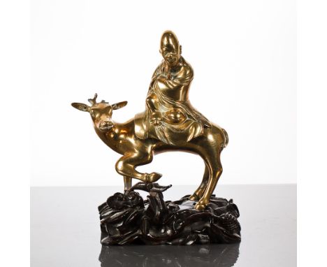 CHINESE BRASS KORO AND BRASS FIGURE AND ANIMAL GROUP 
of rectangular form and with foe dog finial, on wooden stand, 24cm high