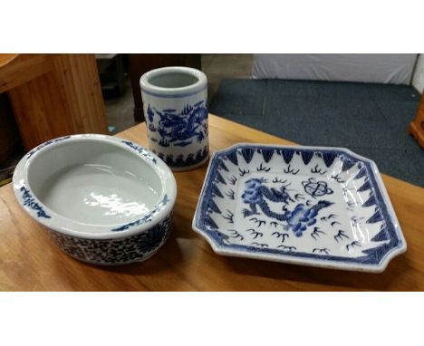 Collection of three blue and white ceramic Chinese dishes including a bonsai dish and a brush pot.