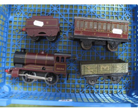 A Hornby 'O' Gauge/7mm Clockwork Type 501 0-4-0 Steam Locomotive and Tender, L.M.S maroon R/No. 5600, unboxed, good, spring o