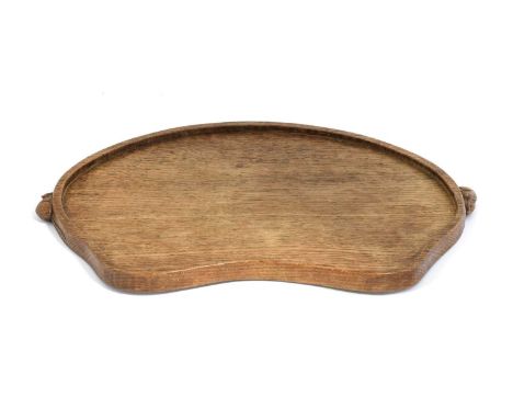 Workshop of Robert Mouseman Thompson (Kilburn): An English Oak Kidney Tea Tray, with carved mouse trademark handles, 47cm wid