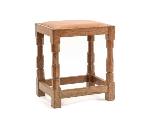 Workshop of Robert Mouseman Thompson (Kilburn): An English Oak Dressing Table Stool, with upholstered cow hide seat, on four 