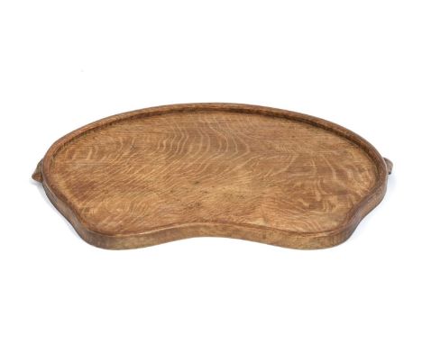 Workshop of Robert Mouseman Thompson (Kilburn): An English Oak Kidney Tea Tray, with carved mouse trademark handles, 46cm wid