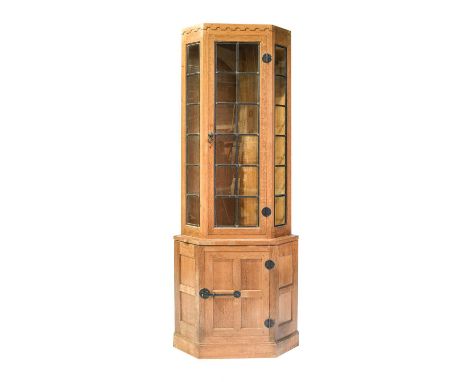 Workshop of Robert Mouseman Thompson (Kilburn): An English Oak Corner Display Cupboard, the upper section with leaded glazed 