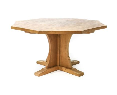 Workshop of Robert Mouseman Thompson (Kilburn): An English Oak 4' 10" Octagonal Dining Table, the adzed top on a cruciform ba