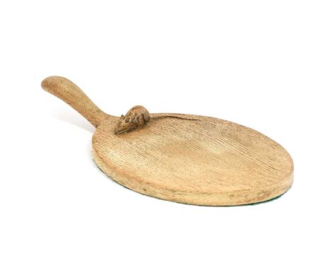 Robert Mouseman Thompson (1876-1955): An English Oak Cheese Board, of standard form, with carved mouse trademark on the board