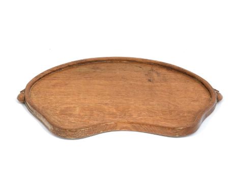 Workshop of Robert Mouseman Thompson (Kilburn): An English Oak Kidney Tea Tray, with carved mouse trademark handles, 47cm wid