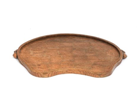 Workshop of Robert Mouseman Thompson (Kilburn): An English Oak Kidney Tea Tray, with carved mouse trademark handles, 48cm wid