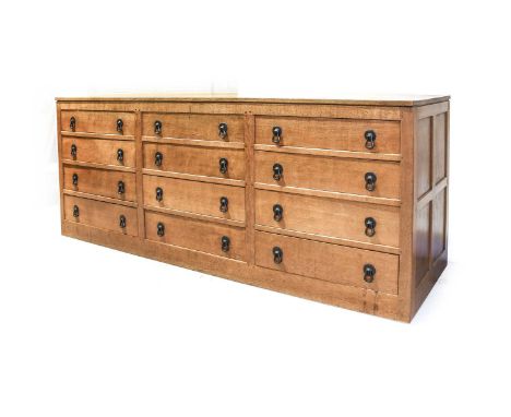 Workshop of Robert Mouseman Thompson (Kilburn): An English Oak Chest of Drawers, two plank adzed top, above three banks of fo