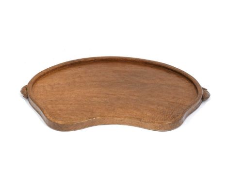 Workshop of Robert Mouseman Thompson (Kilburn): An English Oak Kidney Tea Tray, with carved mouse trademark handles, 47cm wid