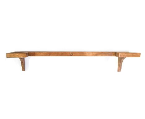 Wrenman: Bob Hunter (Thirlby): An English Oak Mantle Shelf, shaped top on two brackets, with recessed carved wren trademark, 